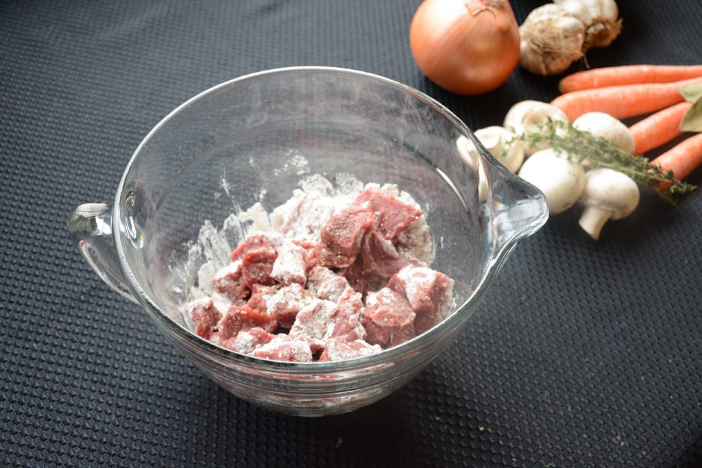 flouring beef for beef stew